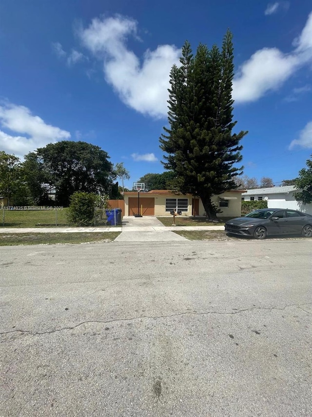 2801 Mayo St, Hollywood, FL 33020 - view of front of home featuring driveway and fence