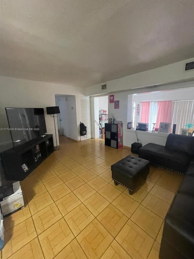 2801 Mayo St, Hollywood, FL 33020 - living room featuring light tile patterned floors and visible vents