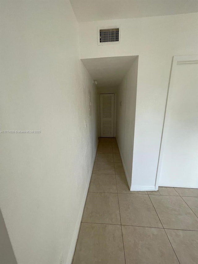 2801 Mayo St, Hollywood, FL 33020 - hallway featuring light tile patterned floors, baseboards, and visible vents