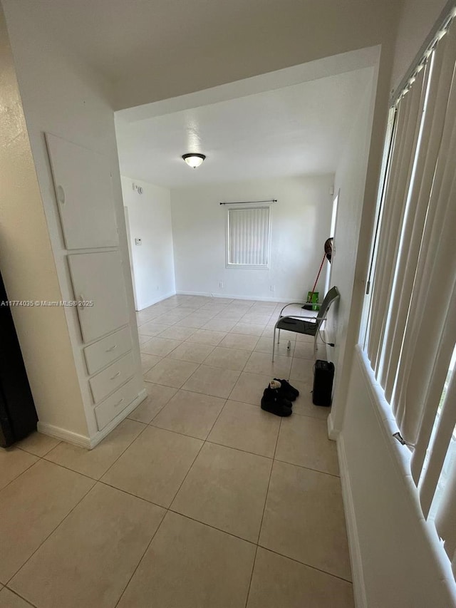 2801 Mayo St, Hollywood, FL 33020 - corridor featuring light tile patterned floors and baseboards