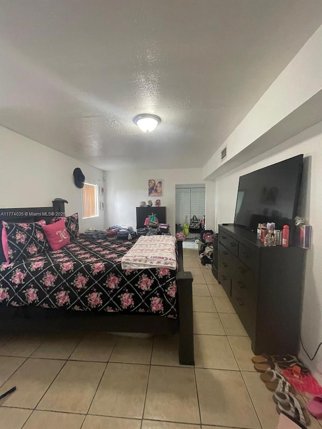2801 Mayo St, Hollywood, FL 33020 - bedroom with light tile patterned floors, visible vents, and a textured ceiling