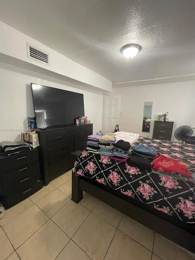 2801 Mayo St, Hollywood, FL 33020 - bedroom featuring visible vents, light tile patterned flooring, and a textured ceiling