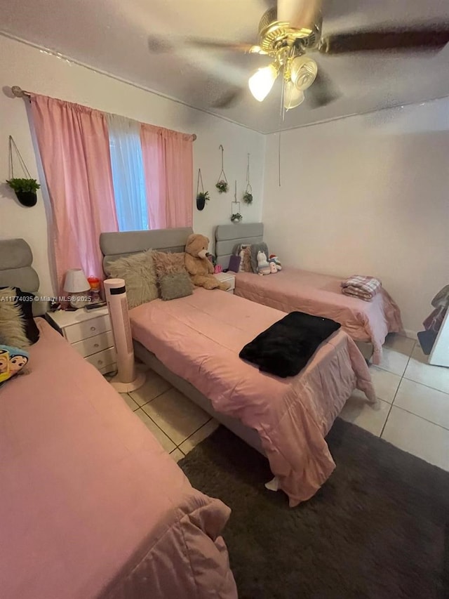 2801 Mayo St, Hollywood, FL 33020 - bedroom with light tile patterned floors and a ceiling fan