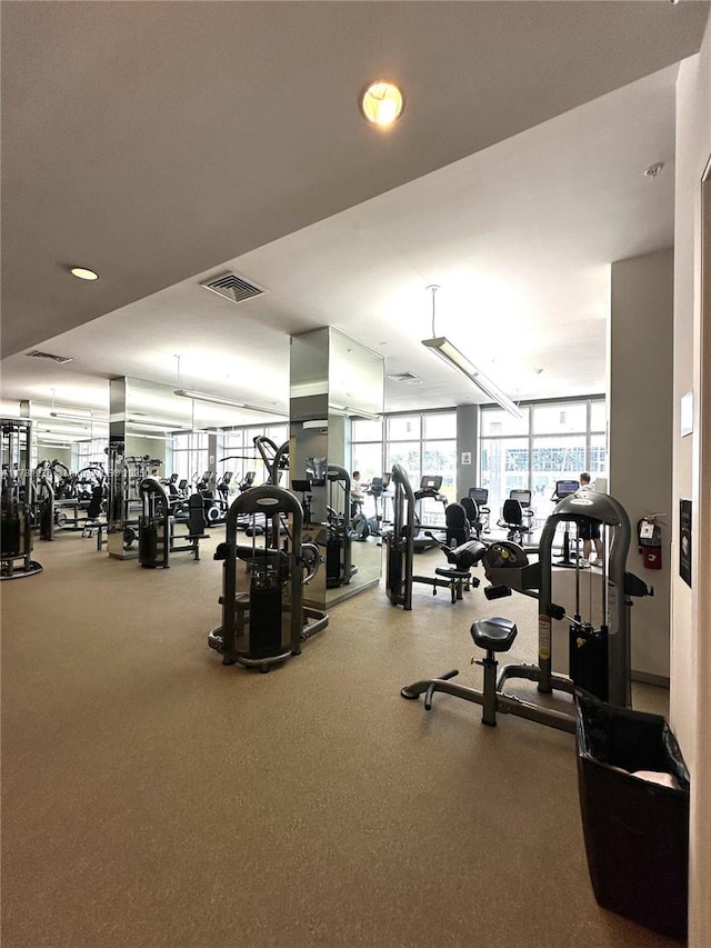 gym with visible vents and recessed lighting