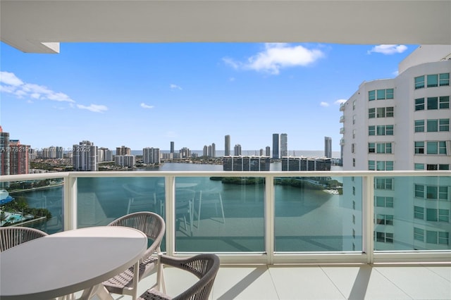 balcony with a view of city and a water view