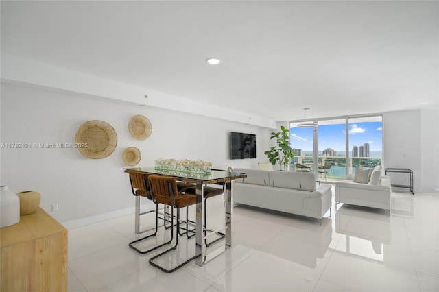 dining room with recessed lighting, baseboards, and floor to ceiling windows