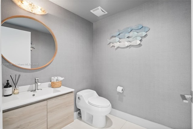 bathroom featuring toilet, visible vents, tile patterned flooring, and vanity
