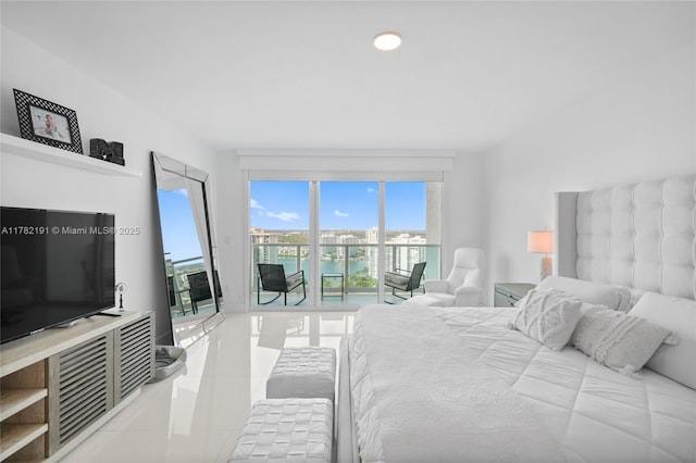 bedroom with a water view, recessed lighting, access to exterior, and light tile patterned floors