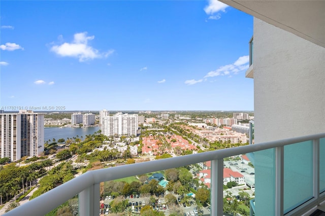 balcony with a water view and a city view