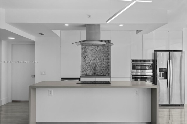 21055 Yacht Club Dr Unit 1409, Aventura, FL 33180 - kitchen featuring a sink, modern cabinets, white cabinetry, exhaust hood, and appliances with stainless steel finishes