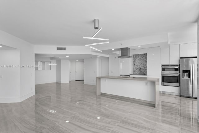 21055 Yacht Club Dr Unit 1409, Aventura, FL 33180 - kitchen featuring white cabinets, visible vents, modern cabinets, range hood, and appliances with stainless steel finishes