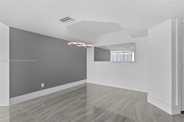 21055 Yacht Club Dr Unit 1409, Aventura, FL 33180 - unfurnished room featuring baseboards, a chandelier, and visible vents