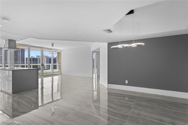 21055 Yacht Club Dr Unit 1409, Aventura, FL 33180 - unfurnished living room featuring a wall of windows, visible vents, baseboards, and a view of city