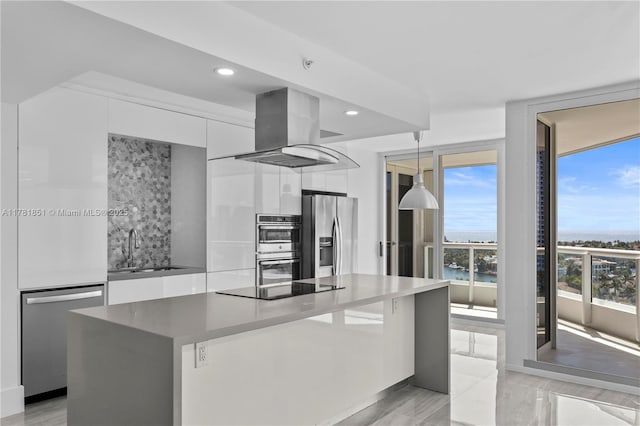 21055 Yacht Club Dr Unit 1409, Aventura, FL 33180 - kitchen featuring white cabinets, island range hood, a sink, modern cabinets, and appliances with stainless steel finishes
