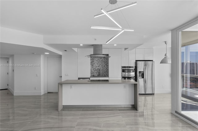 21055 Yacht Club Dr Unit 1409, Aventura, FL 33180 - kitchen featuring wall chimney range hood, modern cabinets, a kitchen island, appliances with stainless steel finishes, and white cabinetry