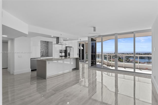 21055 Yacht Club Dr Unit 1409, Aventura, FL 33180 - unfurnished living room with floor to ceiling windows and baseboards