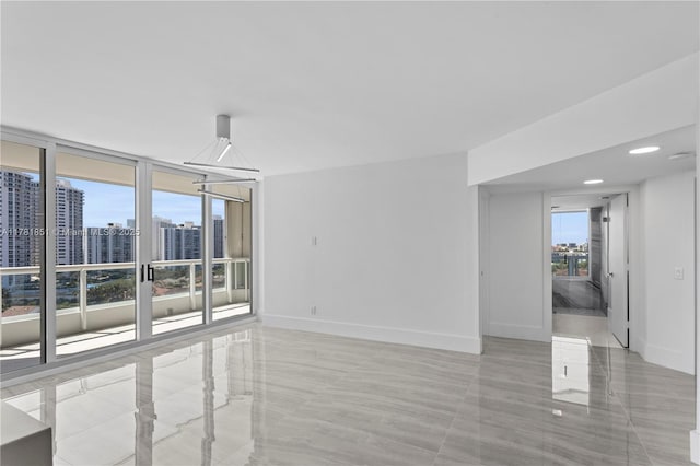 21055 Yacht Club Dr Unit 1409, Aventura, FL 33180 - tiled spare room with a city view and baseboards