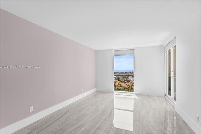 21055 Yacht Club Dr Unit 1409, Aventura, FL 33180 - spare room with baseboards