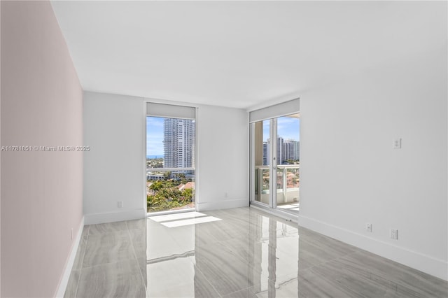 21055 Yacht Club Dr Unit 1409, Aventura, FL 33180 - empty room featuring baseboards and a view of city