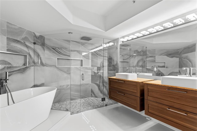 21055 Yacht Club Dr Unit 1409, Aventura, FL 33180 - bathroom featuring a freestanding bath, a stall shower, vanity, and tile walls