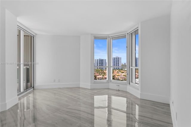21055 Yacht Club Dr Unit 1409, Aventura, FL 33180 - empty room featuring a view of city and baseboards