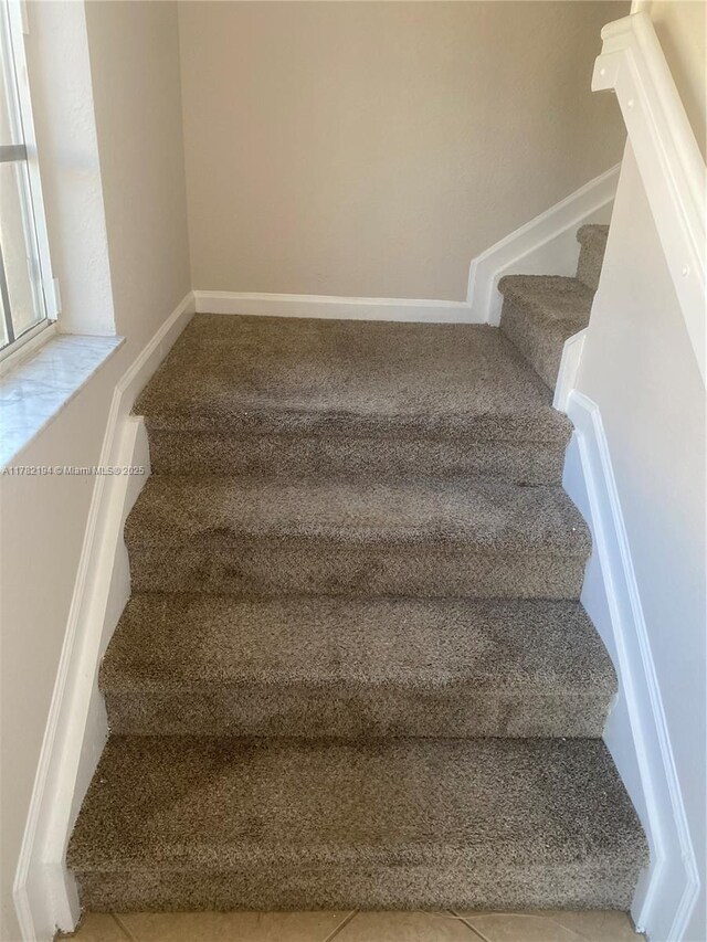 1961 Freeport Ln Unit 0, Riviera Beach, FL 33404 - bathroom with tile patterned floors, toilet, vanity, and a stall shower