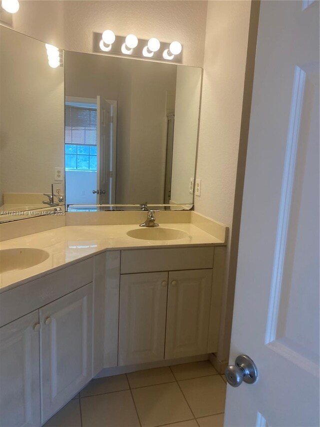 1961 Freeport Ln Unit 0, Riviera Beach, FL 33404 - unfurnished room featuring tile patterned flooring, baseboards, and carpet flooring