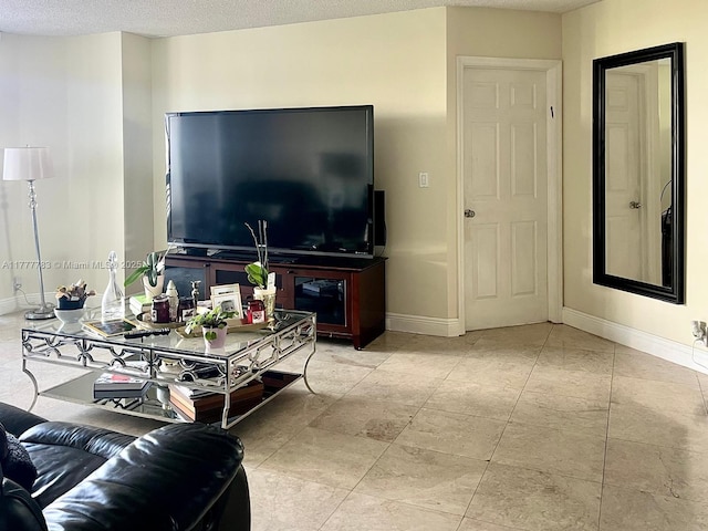 3530 Mystic Pointe Dr Unit 408, Aventura, FL 33180 - living area featuring baseboards and a textured ceiling