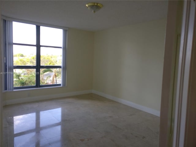 3530 Mystic Pointe Dr Unit 408, Aventura, FL 33180 - empty room featuring baseboards