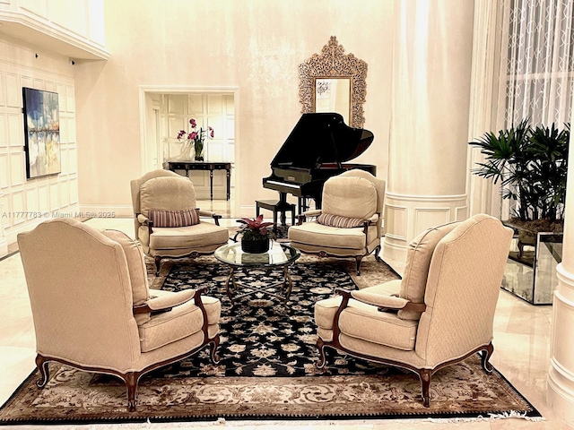 3530 Mystic Pointe Dr Unit 408, Aventura, FL 33180 - sitting room featuring a decorative wall