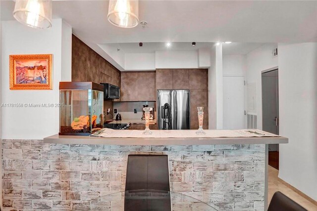 1755 E Hallandale Beach Blvd Unit 1608E, Hallandale Beach, FL 33009 - kitchen featuring stainless steel fridge, black microwave, and light countertops