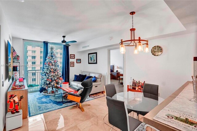 1755 E Hallandale Beach Blvd Unit 1608E, Hallandale Beach, FL 33009 - dining space with floor to ceiling windows, a chandelier, and ceiling fan