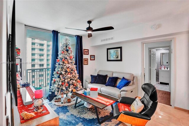 1755 E Hallandale Beach Blvd Unit 1608E, Hallandale Beach, FL 33009 - living room featuring expansive windows, ceiling fan, and wood finished floors