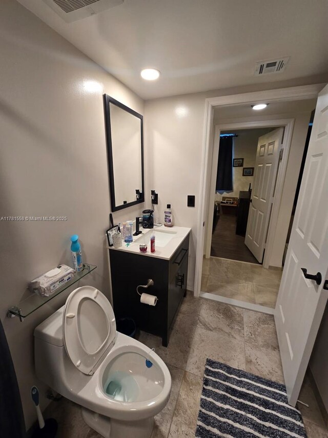 1755 E Hallandale Beach Blvd Unit 1608E, Hallandale Beach, FL 33009 - bathroom with toilet, vanity, and baseboards