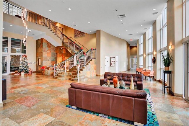 1755 E Hallandale Beach Blvd Unit 1608E, Hallandale Beach, FL 33009 - building lobby with a towering ceiling, recessed lighting, and stairs