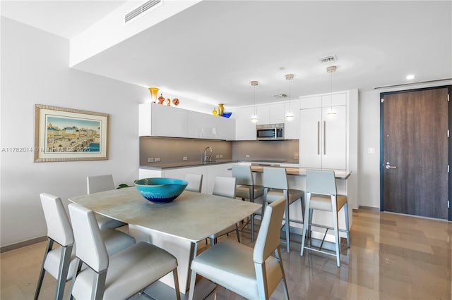 68 SE 6th St Unit 810, Miami, FL 33131 - dining room featuring baseboards