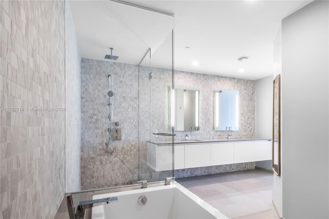68 SE 6th St Unit 810, Miami, FL 33131 - bathroom featuring a tile shower, double vanity, and a bathtub