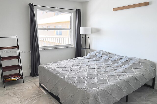 121 Golden Isles Dr Unit 803, Hallandale Beach, FL 33009 - bedroom featuring marble look tile flooring