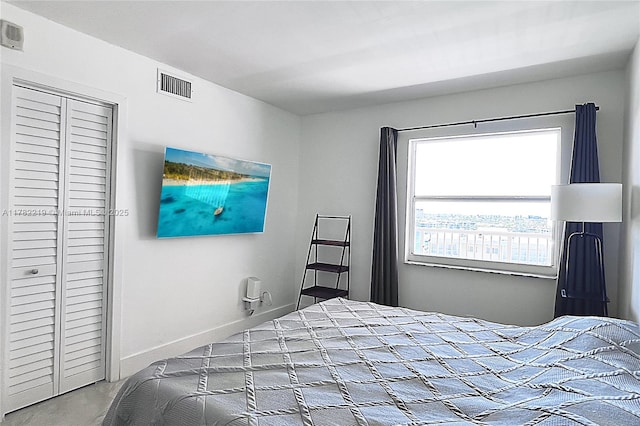 bedroom featuring visible vents and a closet