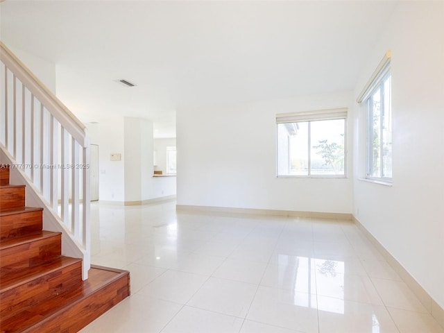 4242 Magnolia Ridge Dr, Weston, FL 33331 - spare room featuring stairway and light tile patterned floors