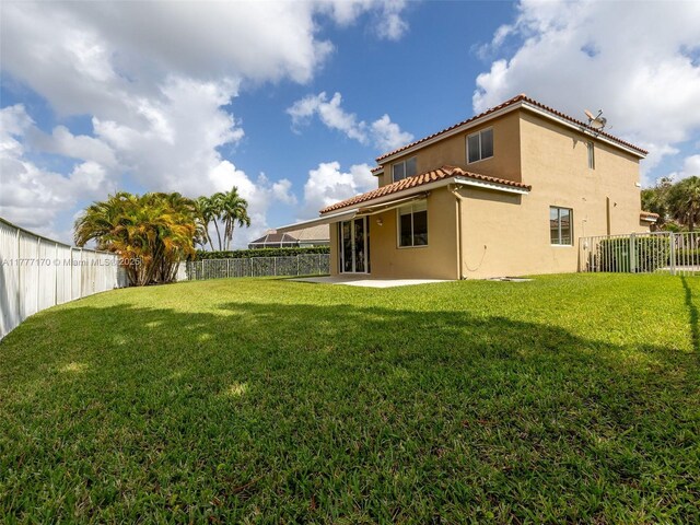 4242 Magnolia Ridge Dr, Weston, FL 33331 - fenced backyard featuring a patio