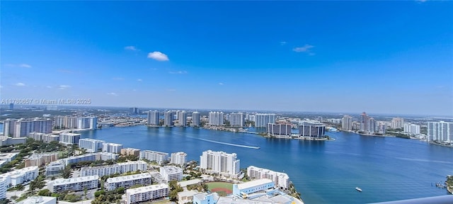 bird's eye view featuring a view of city and a water view