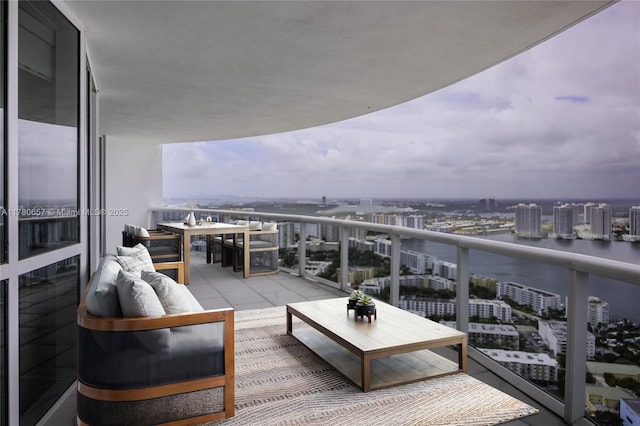 balcony with a view of city and outdoor lounge area