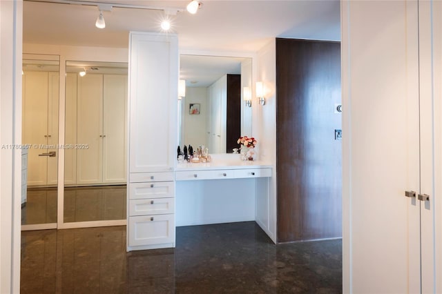 bathroom featuring rail lighting