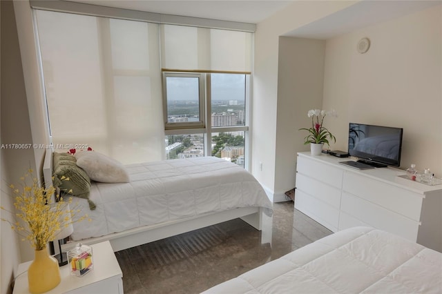 bedroom featuring a wall of windows