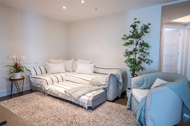 living area with recessed lighting and baseboards
