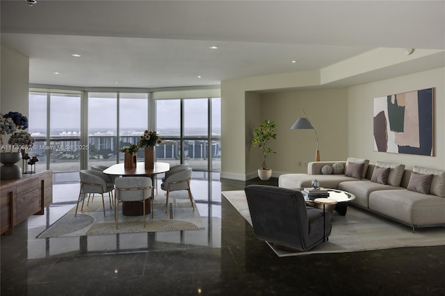 living room with recessed lighting, plenty of natural light, and expansive windows