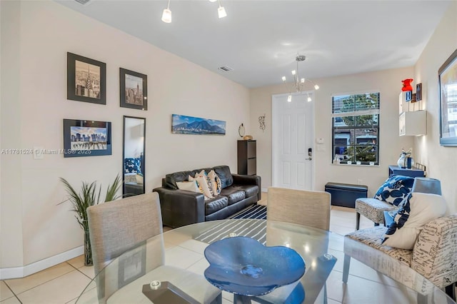 living area featuring light tile patterned floors, baseboards, and visible vents