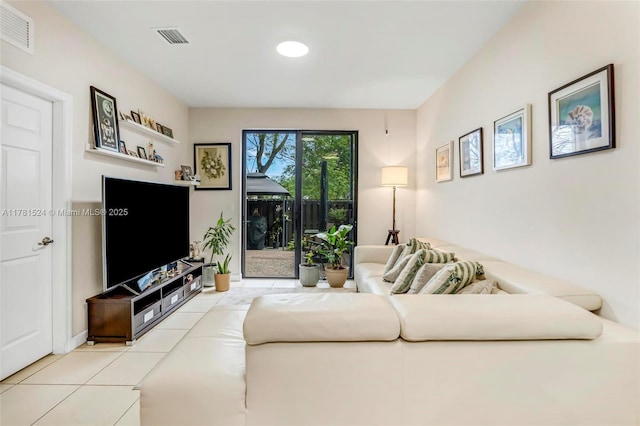 living room with recessed lighting, light tile patterned floors, and visible vents