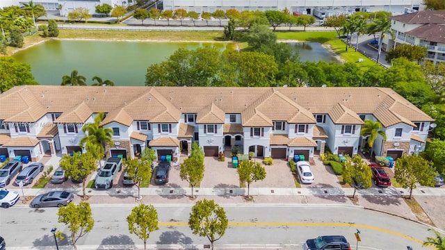bird's eye view with a water view and a residential view